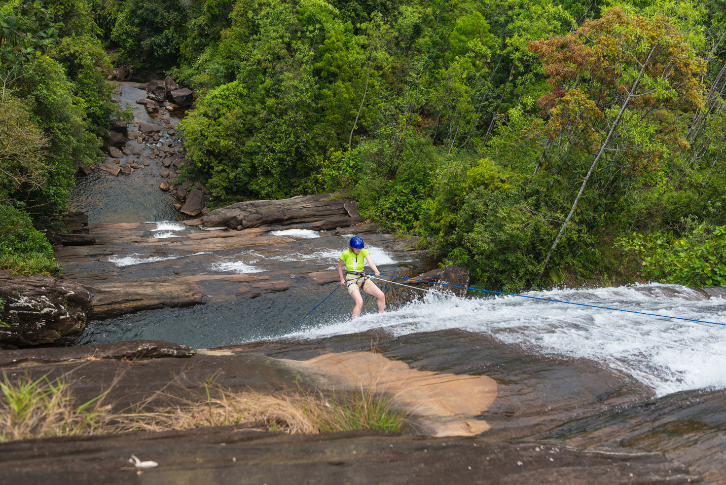 Woman waterfall abseiling